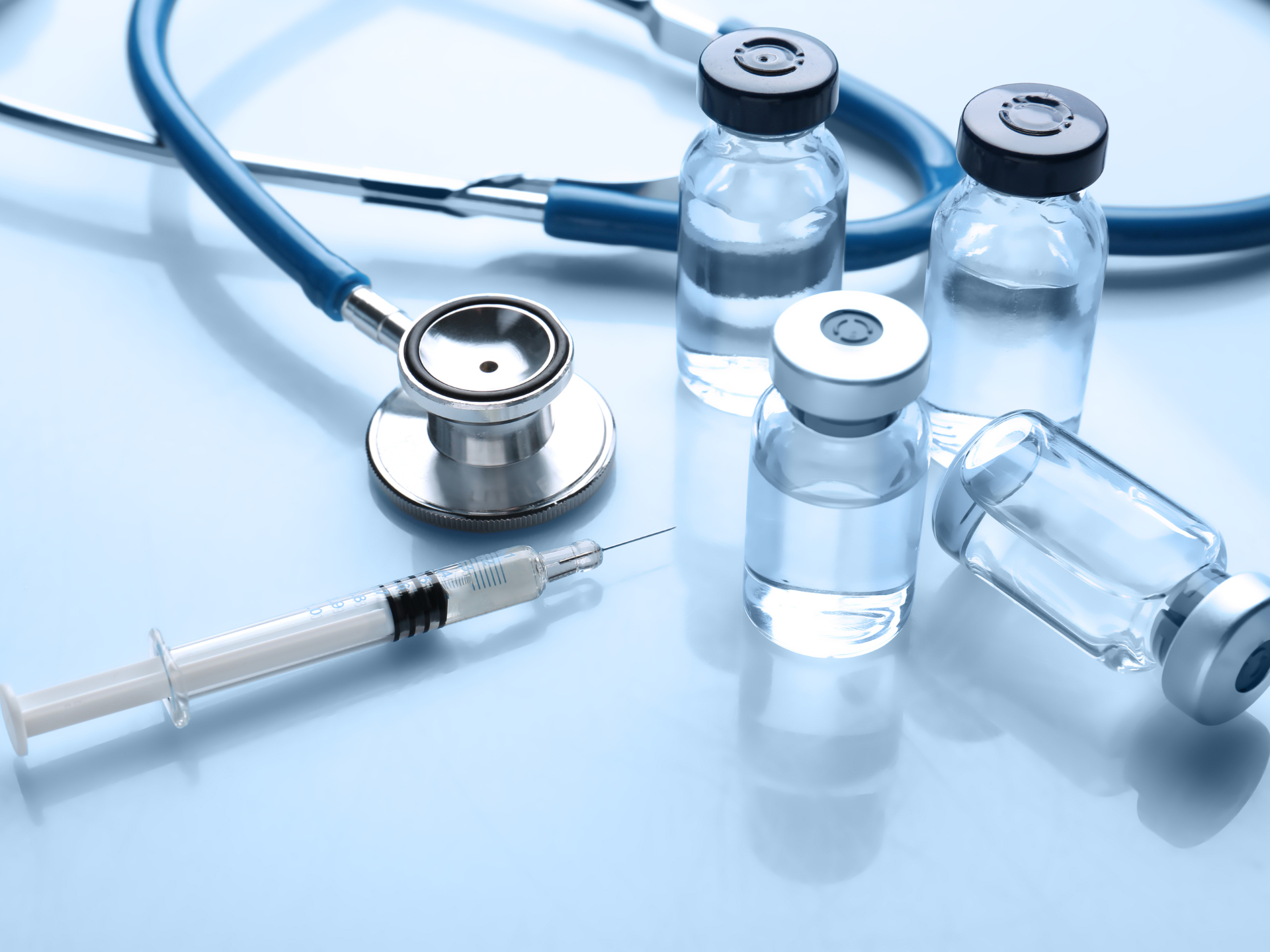Medical logistics — pharmaceutical vials and stethoscope